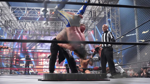 Jon Moxley throws Kenny Omega onto a bed of nails
